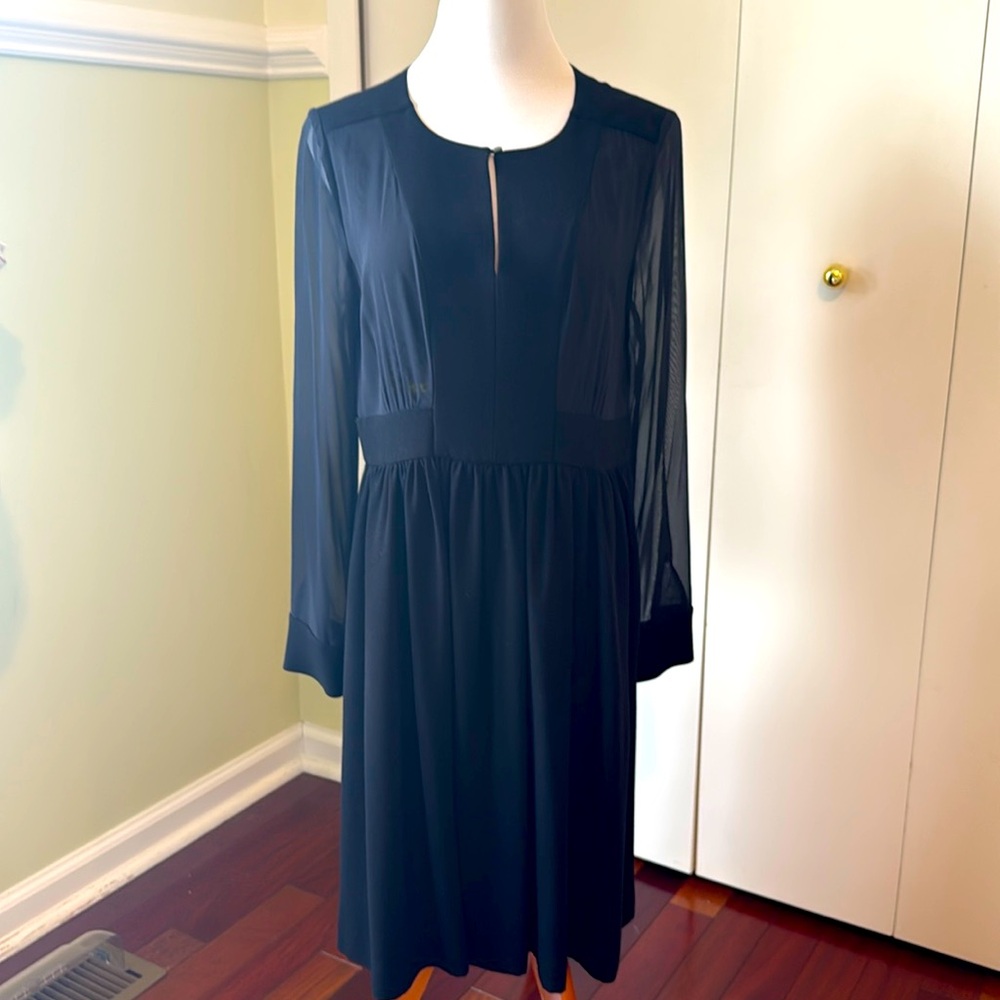 Beautiful long sleeve black dress by DKNY size 10. Very good condition.